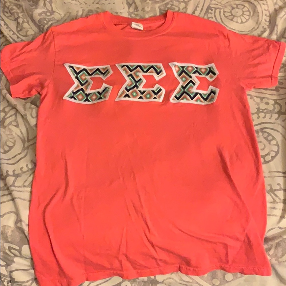 Sigma Sigma Sigma tribal letters.